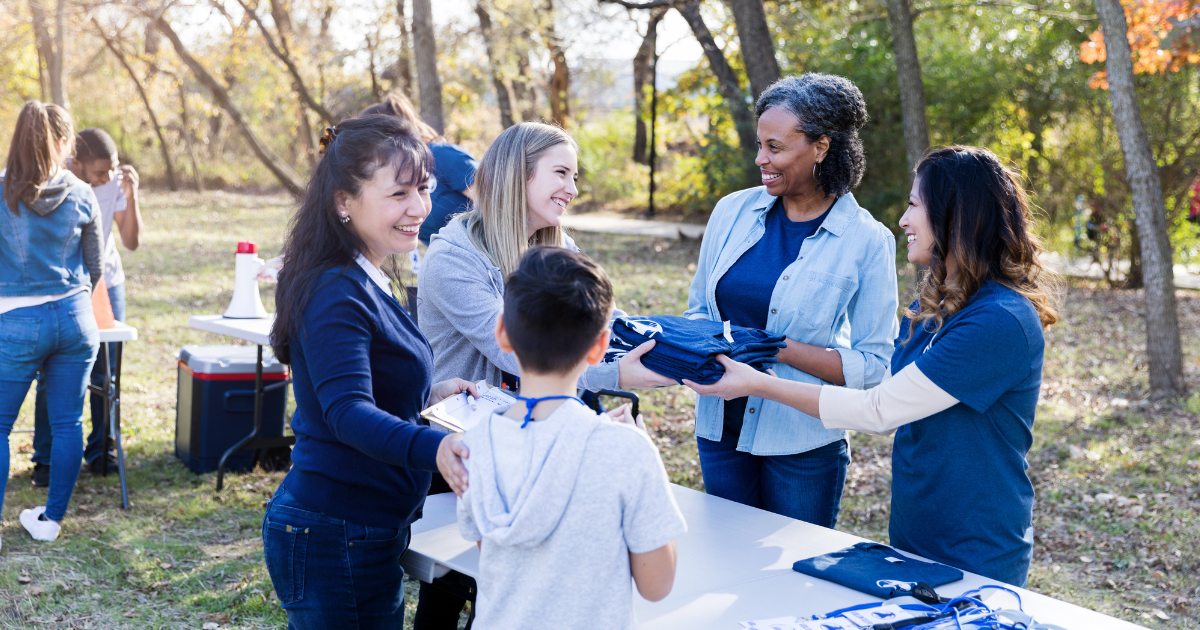 A group of people at a community event, highlighting the importance of participating in events during National Recovery Month.